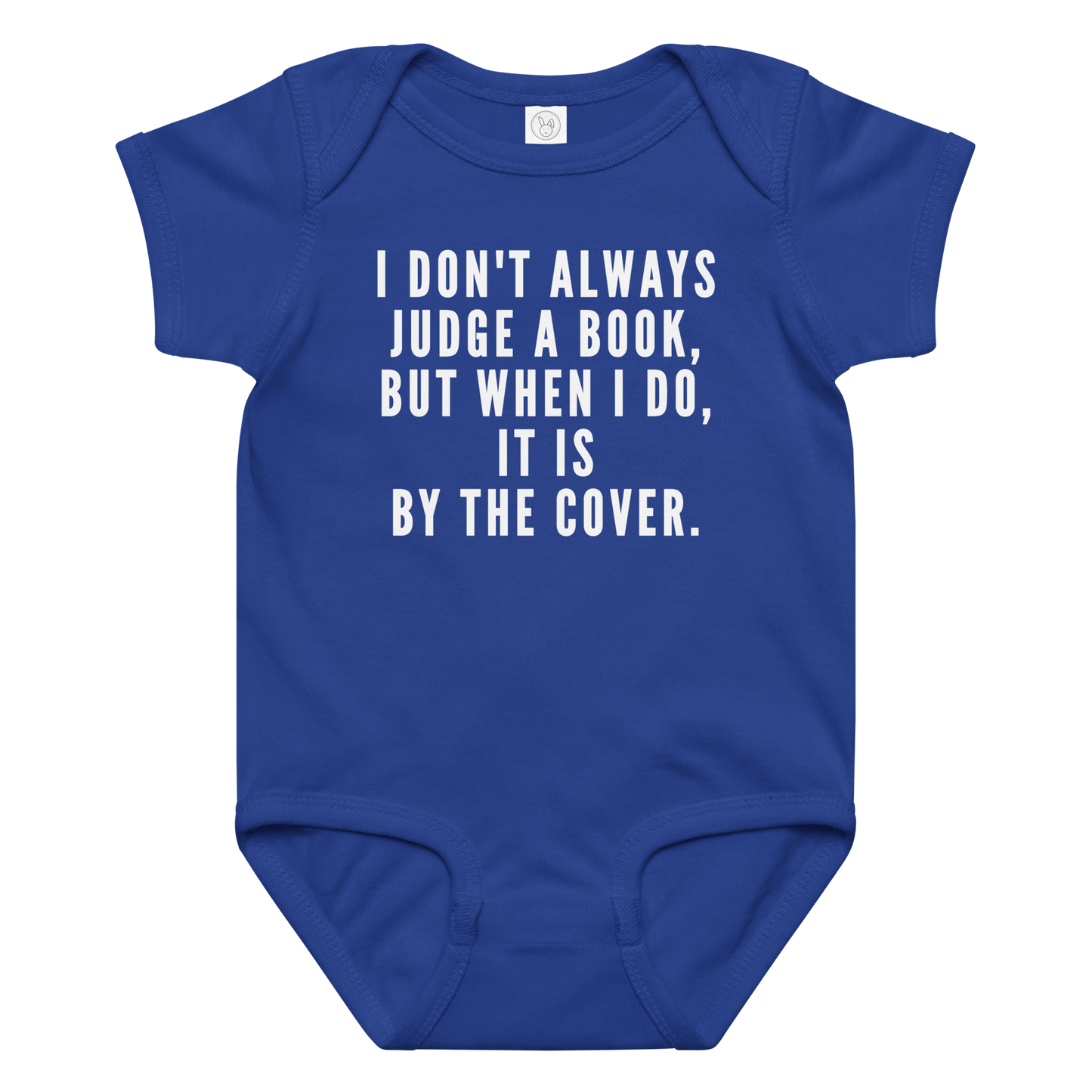"I Don't always Judge a Book, but when I do, it's by the cover." printed on a royal baby jersey bodysuit laying on a flat surface amongst other clothes