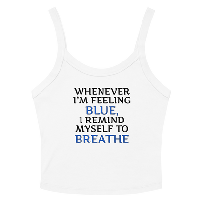 "Whenever I'm feeling blue, I remind myself to breathe" printed on a solid white blend women's micro-rib tanktop laying on a flat surface amongst sunglasses and shorts