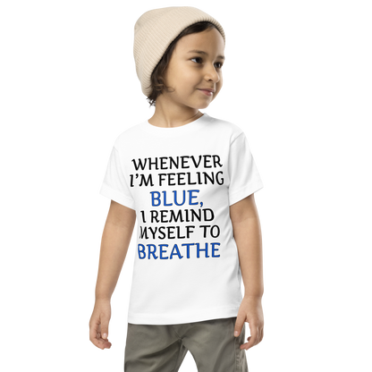 "Whenever I'm feeling blue, I remind myself to breathe" printed on a white toddler short sleeve tee worn by a male wearing a cap