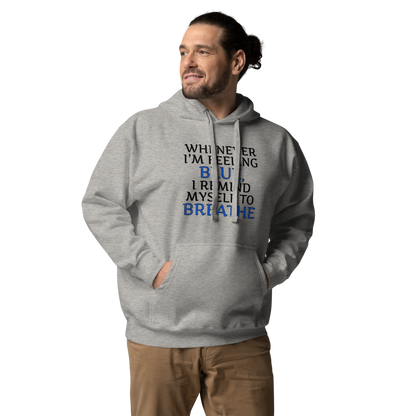 "Whenever I'm feeling blue, I remind myself to breathe" printed on a carbon grey unisex hoodie worn by a male