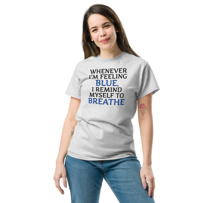 "Whenever I'm feeling blue, I remind myself to breathe" printed on a ash unisex classic tee worn by a female
