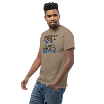 "Whenever I'm feeling blue, I remind myself to breathe" printed on a brown savana unisex classic tee worn by a male