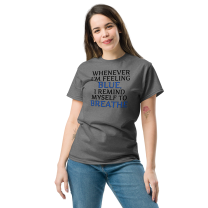 "Whenever I'm feeling blue, I remind myself to breathe" printed on a graphite heather unisex classic tee worn by a female