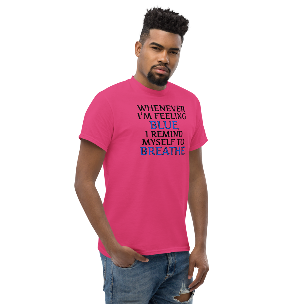 "Whenever I'm feeling blue, I remind myself to breathe" printed on a heliconia unisex classic tee worn by a male