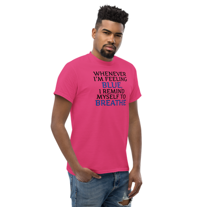 "Whenever I'm feeling blue, I remind myself to breathe" printed on a heliconia unisex classic tee worn by a male