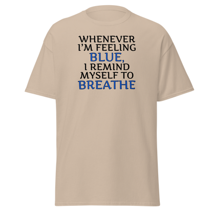 "Whenever I'm feeling blue, I remind myself to breathe" printed on a sand on an invisible body