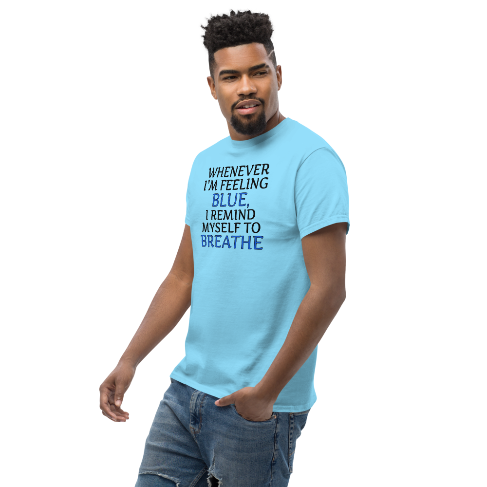 "Whenever I'm feeling blue, I remind myself to breathe" printed on a sky unisex classic tee worn by a male