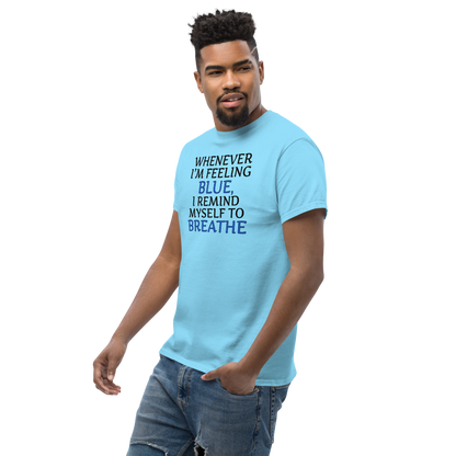 "Whenever I'm feeling blue, I remind myself to breathe" printed on a sky unisex classic tee worn by a male