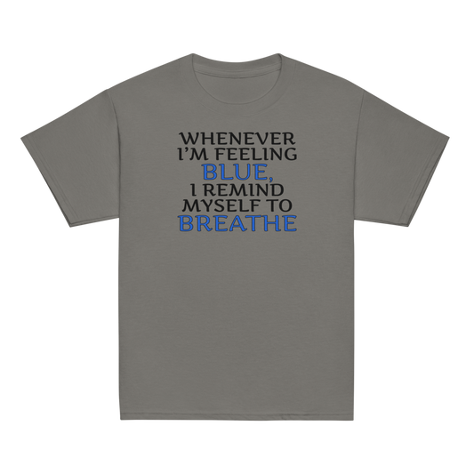 "Whenever I'm feeling blue, I remind myself to breathe" printed on a charcoal youth classic tee laying on a flat surface