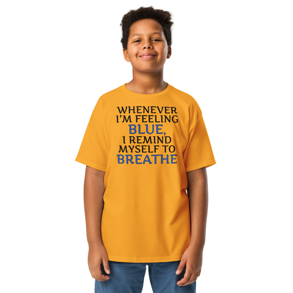 "Whenever I'm feeling blue, I remind myself to breathe" printed on a gold youth classic tee worn by a male
