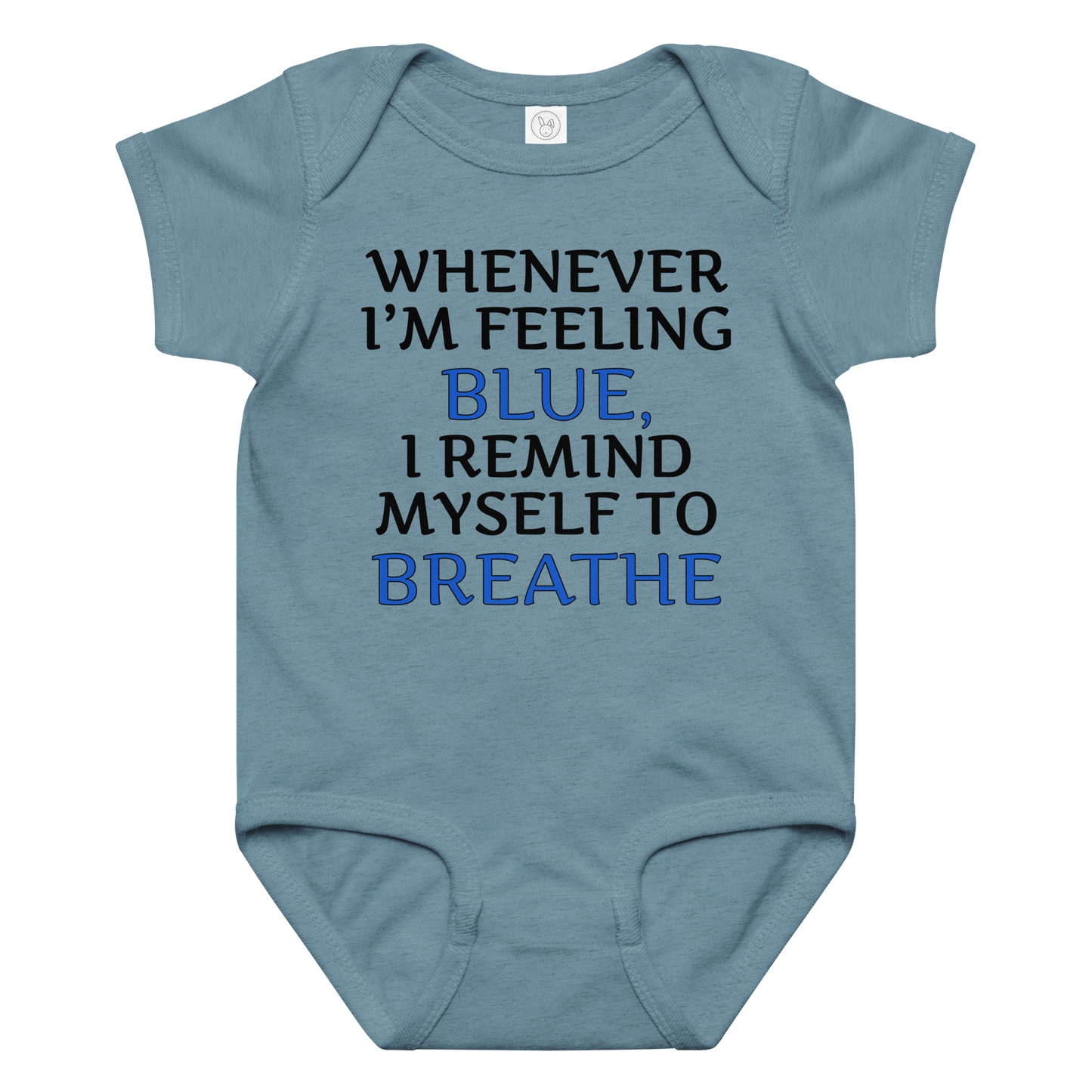 "Whenever I'm feeling blue, I remind myself to breathe" printed on a vintage indigo baby jersey bodysuit laying on a flat surface amongst other clothes