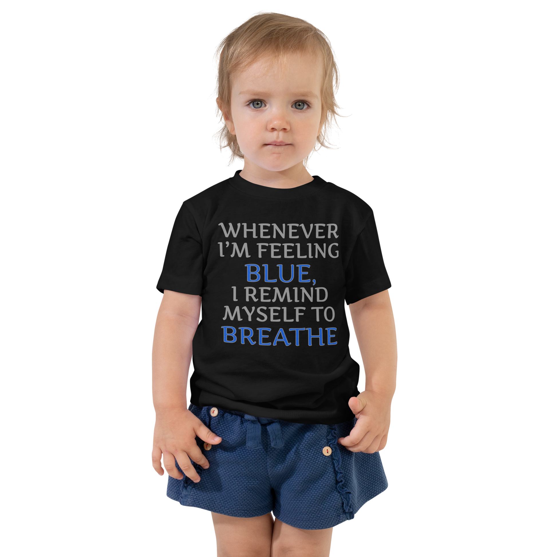 "Whenever I'm feeling blue, I remind myself to breathe" printed on a black toddler short sleeve tee worn by a female