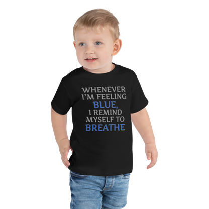 "Whenever I'm feeling blue, I remind myself to breathe" printed on a black toddler short sleeve tee worn by a male