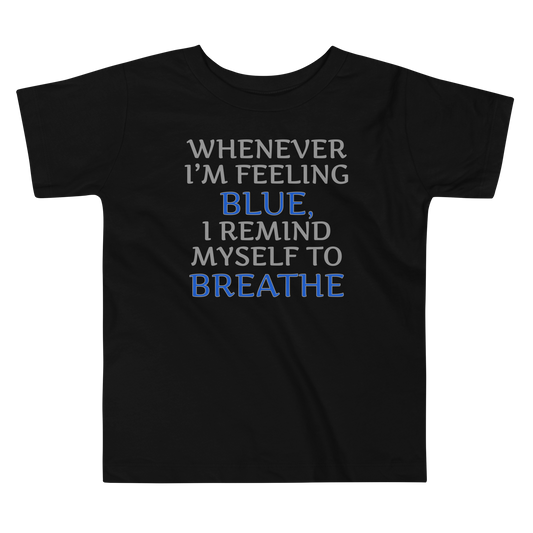 "Whenever I'm feeling blue, I remind myself to breathe" printed on a black toddler short sleeve tee laying on a flat surface