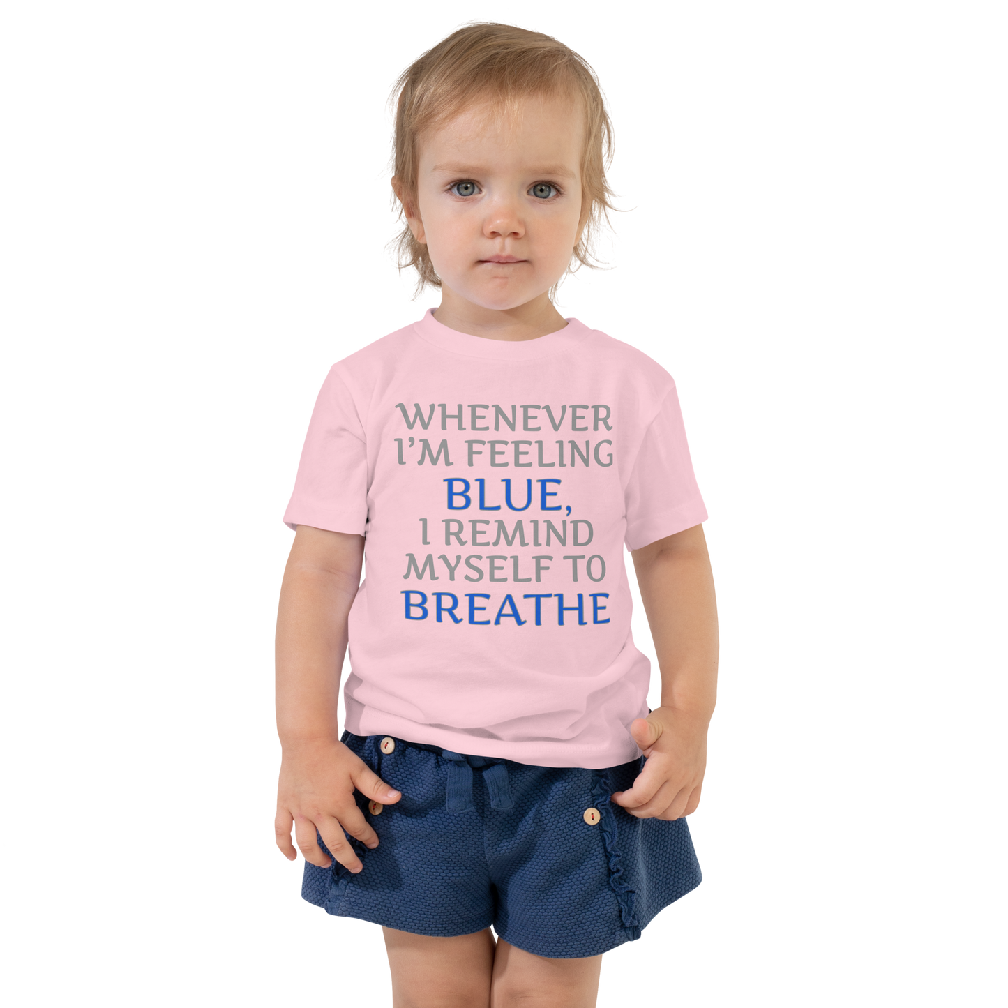 "Whenever I'm feeling blue, I remind myself to breathe" printed on a pink toddler short sleeve tee worn by a female
