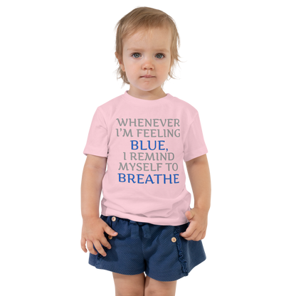 "Whenever I'm feeling blue, I remind myself to breathe" printed on a pink toddler short sleeve tee worn by a female