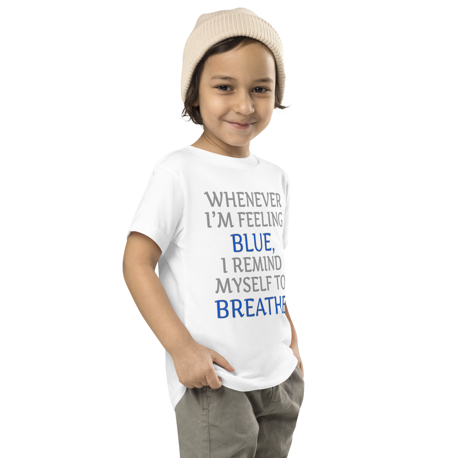 "Whenever I'm feeling blue, I remind myself to breathe" printed on a white toddler short sleeve tee worn by a male who is also wearing a knit cap