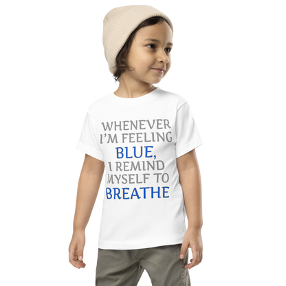 "Whenever I'm feeling blue, I remind myself to breathe" printed on a white toddler short sleeve tee worn by a male wearing a cap