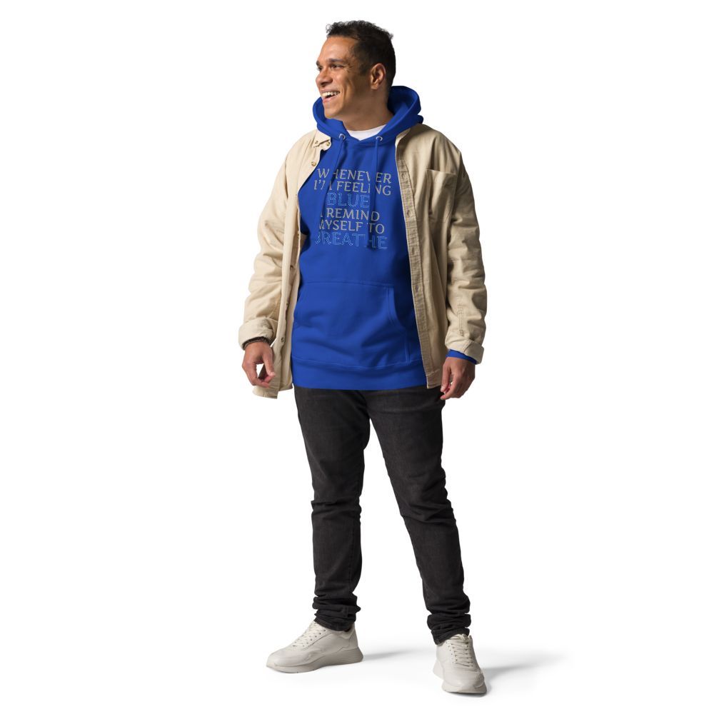 "Whenever I'm feeling blue, I remind myself to breathe" printed on a team royal unisex hoodie worn by a male with a jacket on top