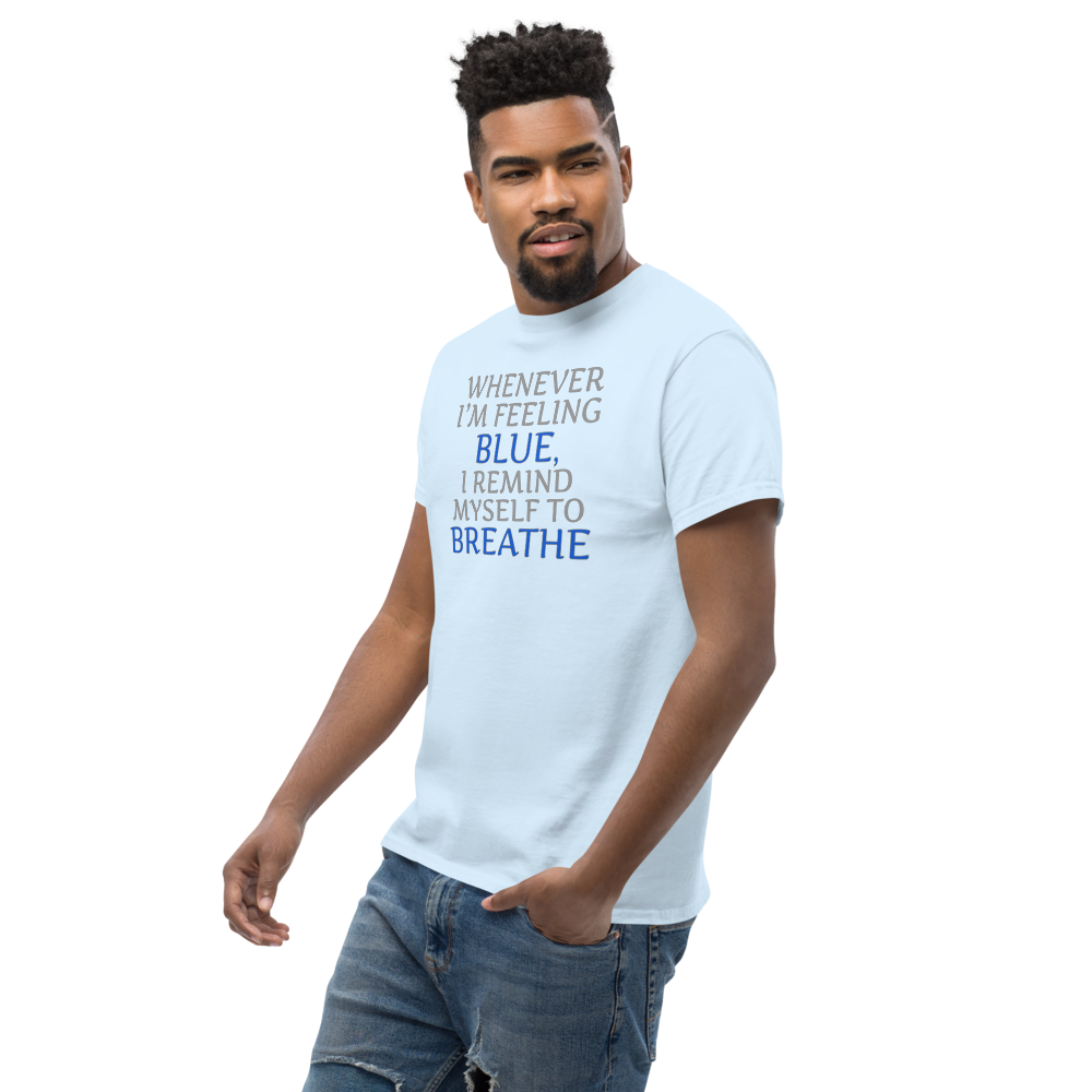 "Whenever I'm feeling blue, I remind myself to breathe" printed on a light blue unisex classic tee worn by a male