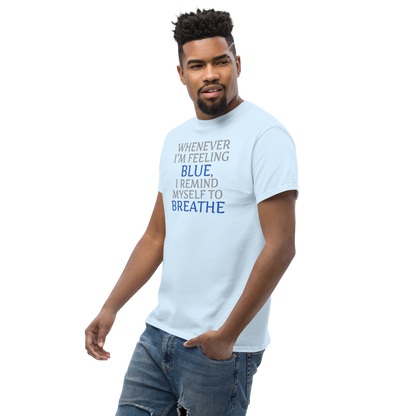 "Whenever I'm feeling blue, I remind myself to breathe" printed on a light blue unisex classic tee worn by a male