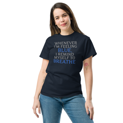"Whenever I'm feeling blue, I remind myself to breathe" printed on a navy unisex classic tee worn by a female