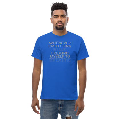 "Whenever I'm feeling blue, I remind myself to breathe" printed on a royal unisex classic tee worn by a male