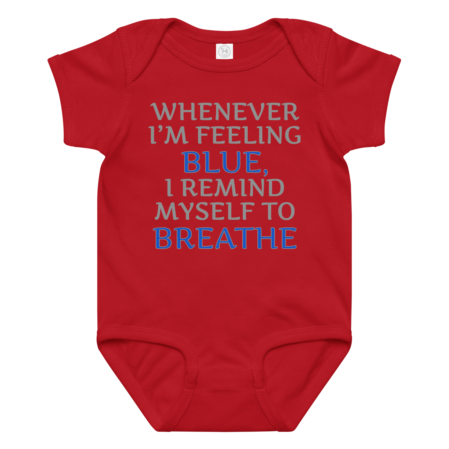 "Whenever I'm feeling blue, I remind myself to breathe" printed on a red baby jersey bodysuit laying on a flat surface amongst other clothes