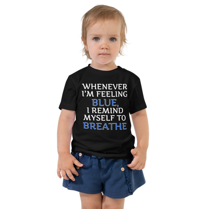 "Whenever I'm feeling blue, I remind myself to breathe" printed on a black toddler short sleeve tee worn by a female