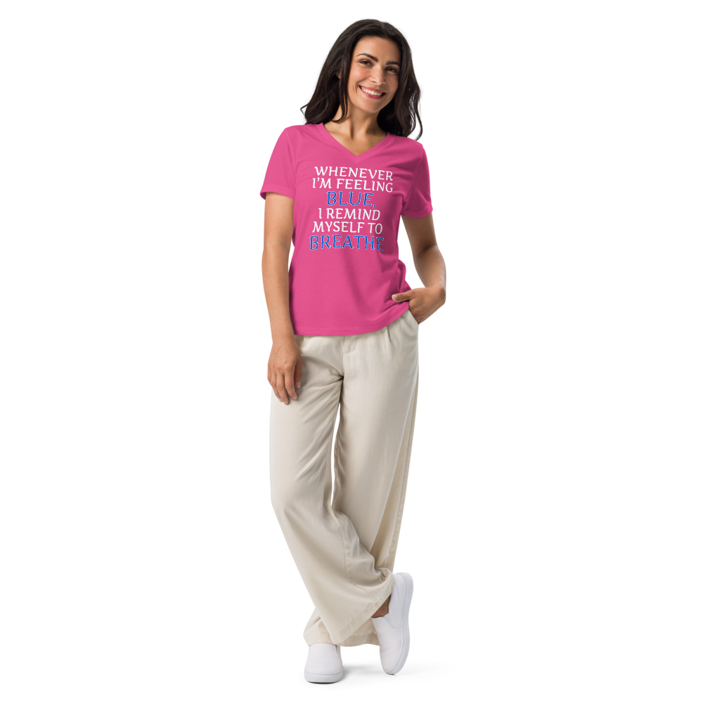 "Whenever I'm feeling blue, I remind myself to breathe" printed on a berry women's relaxed v-neck t-shirt worn by a female