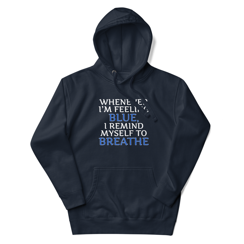 "Whenever I'm feeling blue, I remind myself to breathe" printed on a navy blazer unisex hoodie laying on a flat surface with the hood up