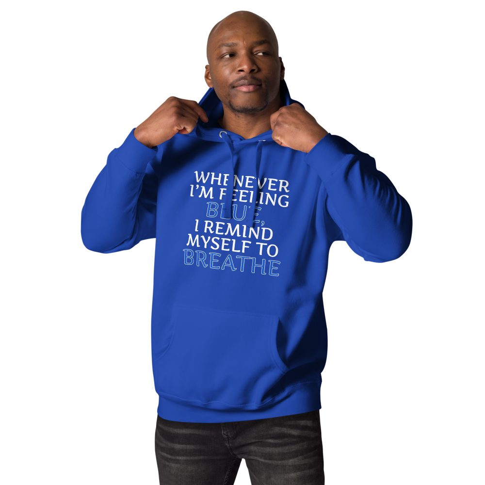 "Whenever I'm feeling blue, I remind myself to breathe" printed on a team royal unisex hoodie worn by a male