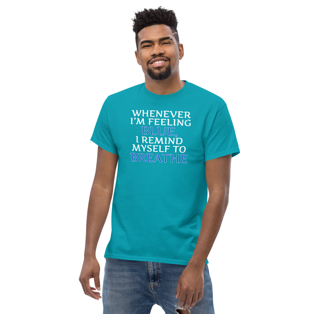 "Whenever I'm feeling blue, I remind myself to breathe" printed on a tropical blue unisex classic tee worn by a male