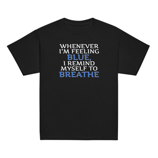 "Whenever I'm feeling blue, I remind myself to breathe" printed on a black youth classic tee laying on a flat surface