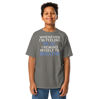 "Whenever I'm feeling blue, I remind myself to breathe" printed on a charcoal youth classic tee worn by a male
