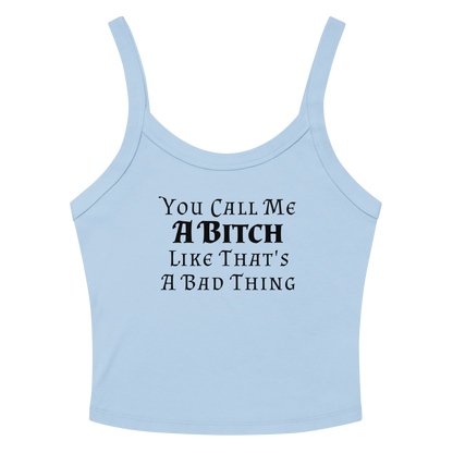 "You Call Me A Bitch Like That's A Bad Thing" printed on a solid baby blue blend women's micro-rib tanktop laying on a flat surface amongst sunglasses and shorts