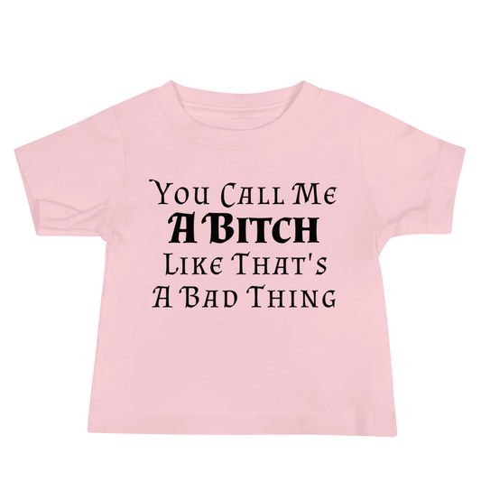 "You Call Me A Bitch Like That's A Bad Thing" printed on a pink baby jersey short sleeve tee laying on a flat surface