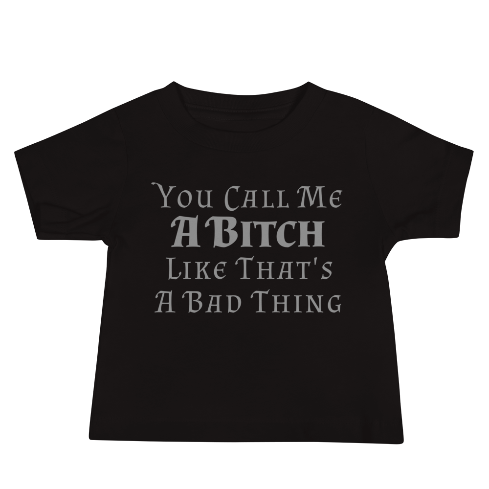 "You Call Me A Bitch Like That's A Bad Thing" printed on a black baby jersey short sleeve tee laying on a flat surface