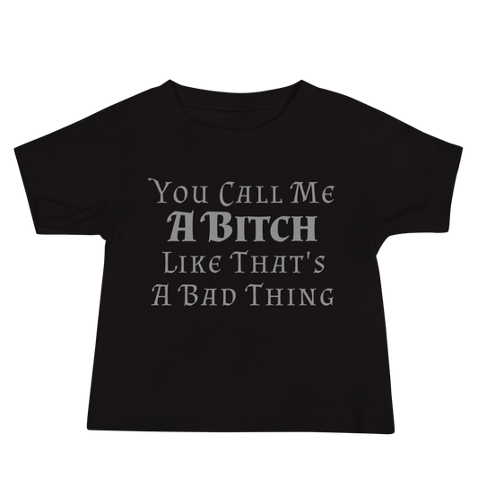"You Call Me A Bitch Like That's A Bad Thing" printed on a black baby jersey short sleeve tee laying on a flat surface