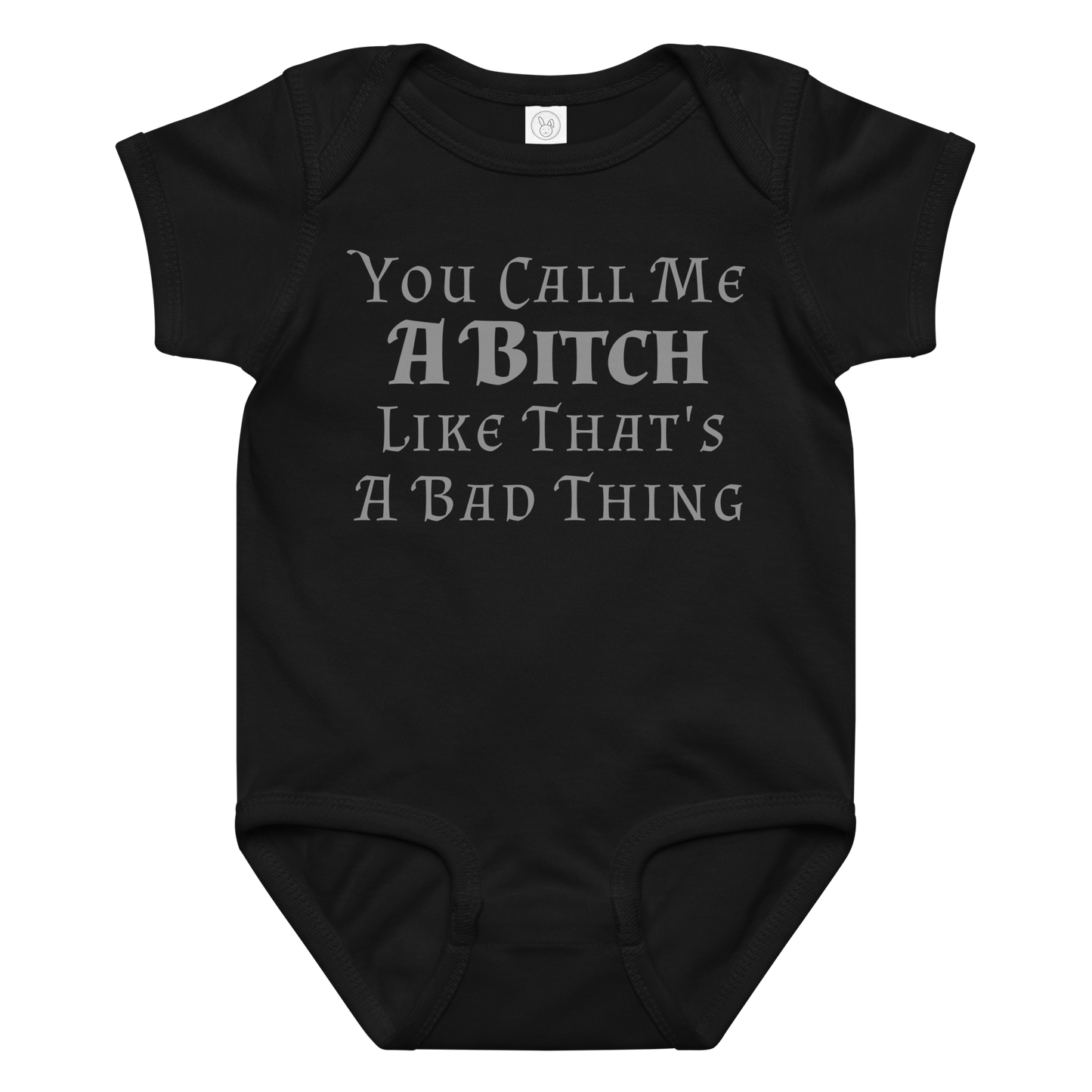 "You Call Me A Bitch Like That's A Bad Thing" printed on a black baby jersey bodysuit laying on a flat surface amongst other clothes