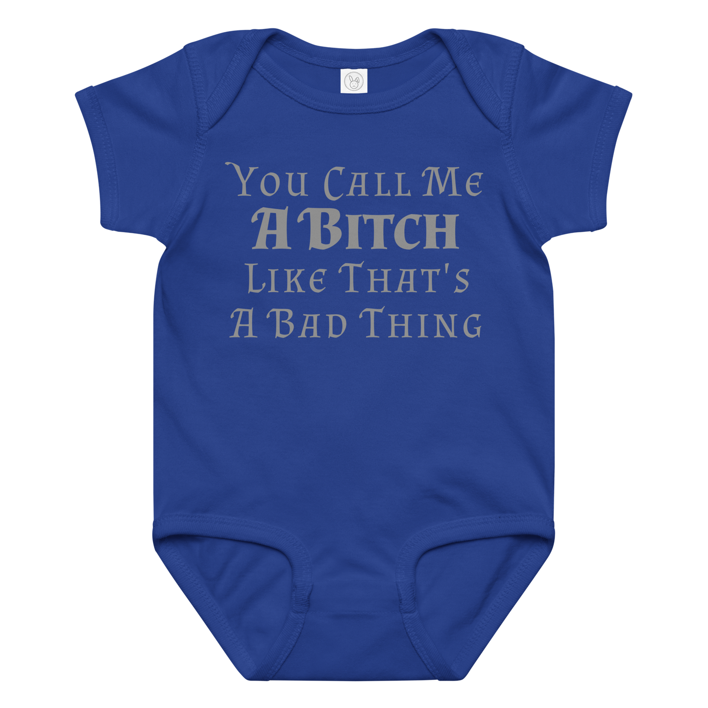 "You Call Me A Bitch Like That's A Bad Thing" printed on a royal baby jersey bodysuit laying on a flat surface amongst other clothes