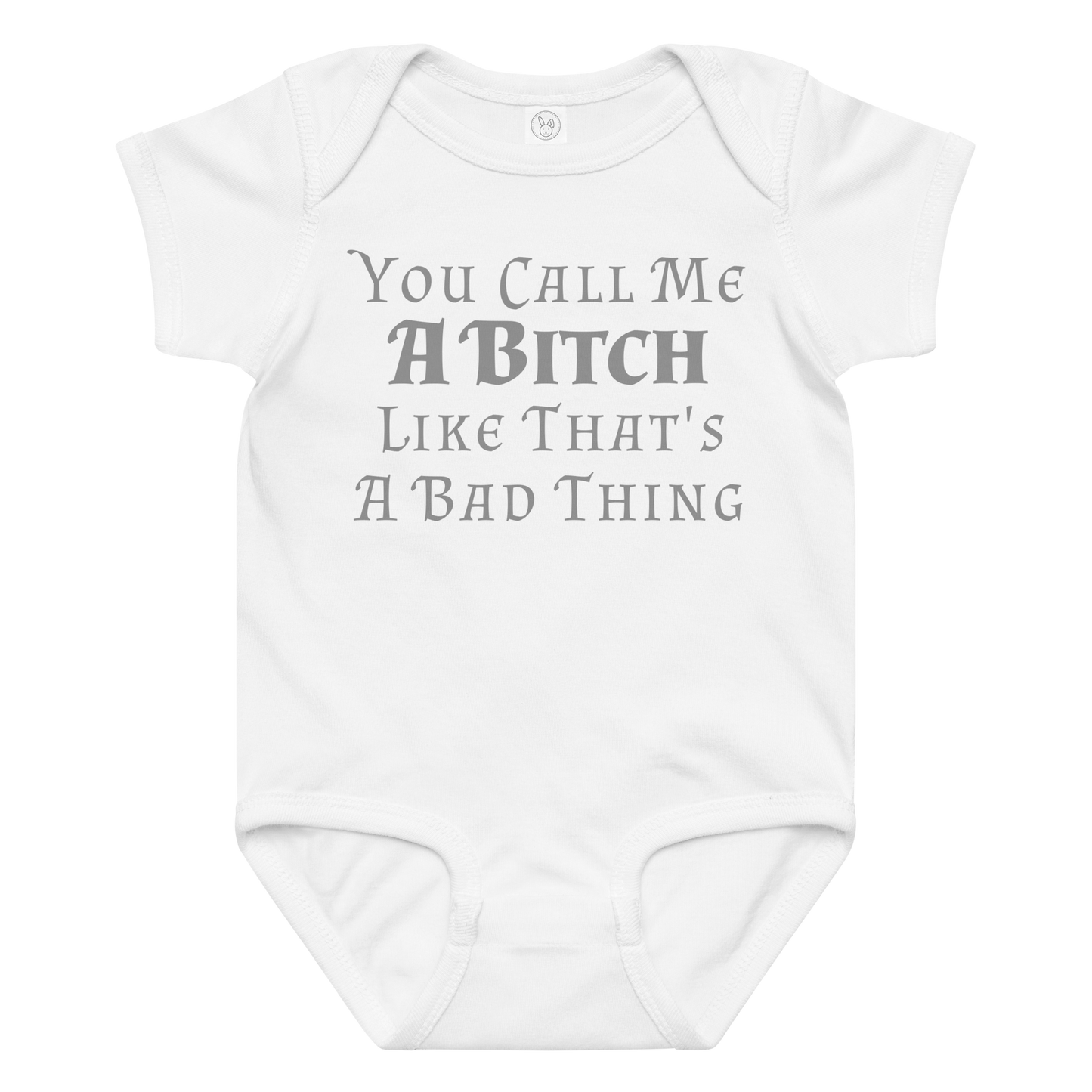 "You Call Me A Bitch Like That's A Bad Thing" printed on a white baby jersey bodysuit laying on a flat surface amongst other clothes