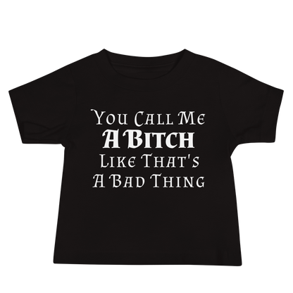 "You Call Me A Bitch Like That's A Bad Thing" printed on a black baby jersey short sleeve tee laying on a flat surface