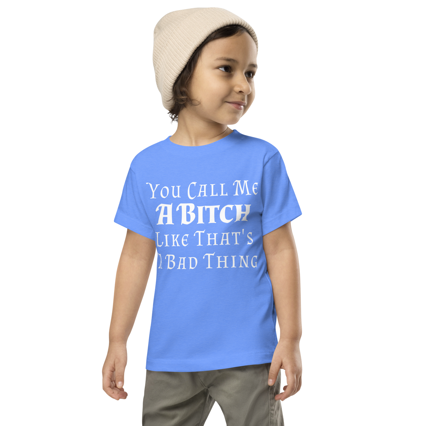 "You Call Me A Bitch Like That's A Bad Thing" printed on a heather columbia blue toddler short sleeve tee worn by a male wearing a cap