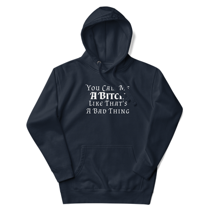 "You Call Me A Bitch Like That's A Bad Thing" printed on a navy blazer unisex hoodie laying on a flat surface with the hood up