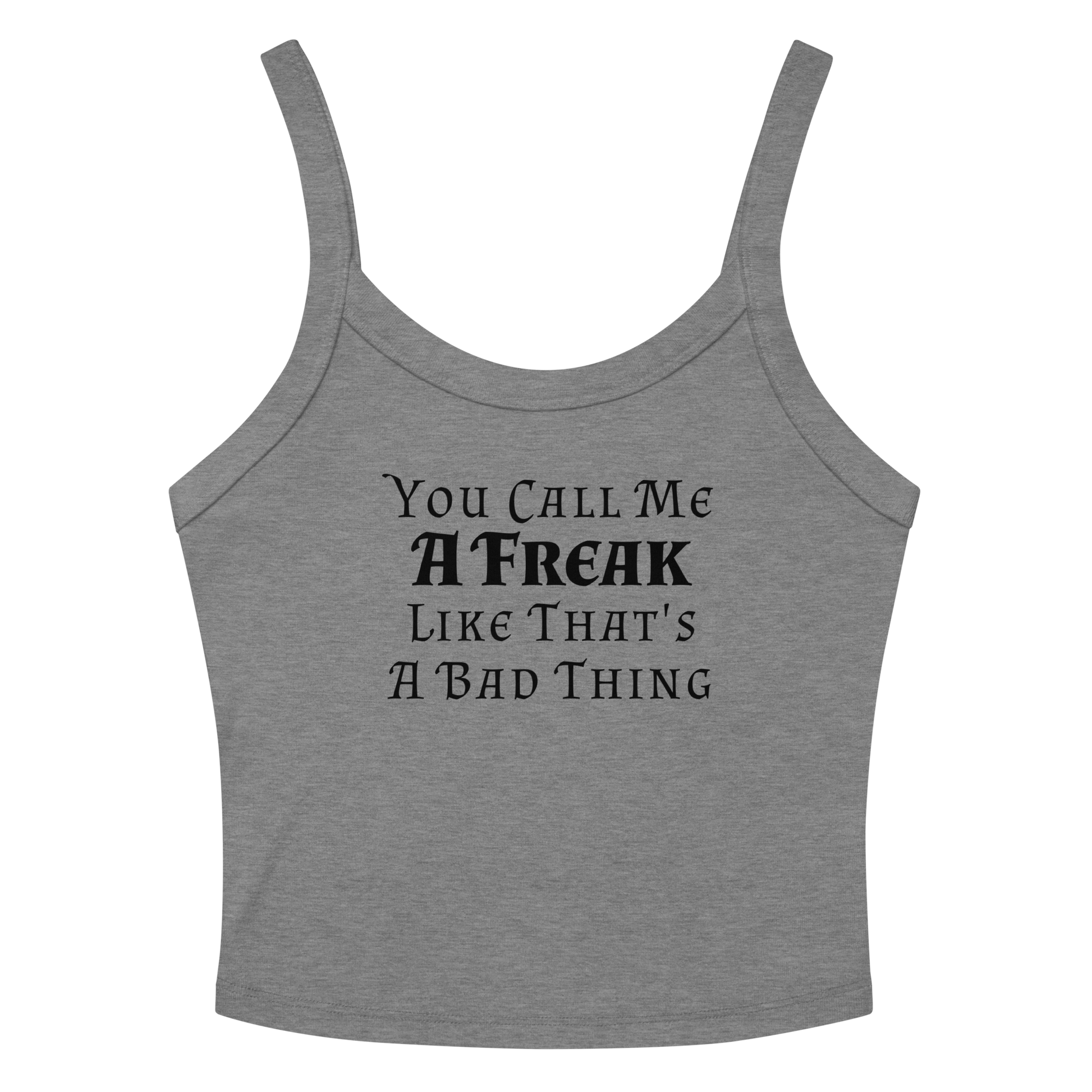 "You Call Me A Freak Like That's A Bad Thing" printed on a athletic heather women's micro-rib tanktop laying on a flat surface amongst sunglasses and shorts