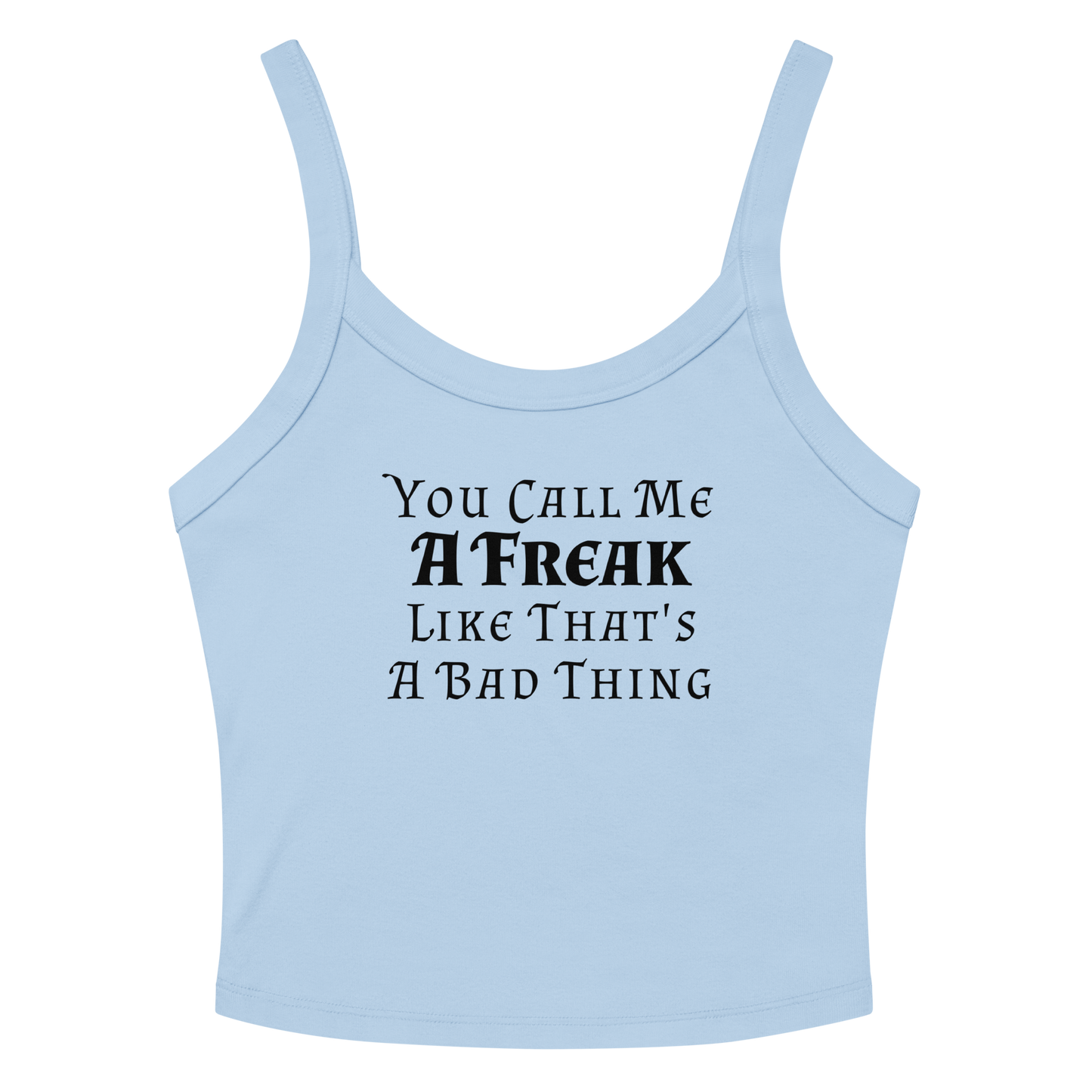 "You Call Me A Freak Like That's A Bad Thing" printed on a solid baby blue blend women's micro-rib tanktop laying on a flat surface amongst sunglasses and shorts