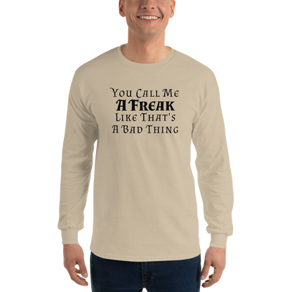 "You Call Me A Freak Like That's A Bad Thing" printed on a sand men's long sleeve shirt worn by a male