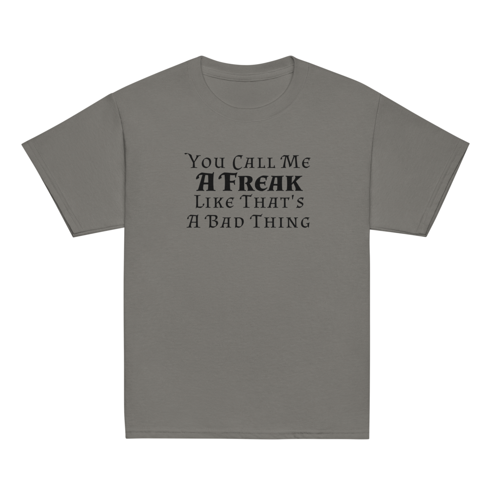 "You Call Me A Freak Like That's A Bad Thing" printed on a charcoal youth classic tee laying on a flat surface