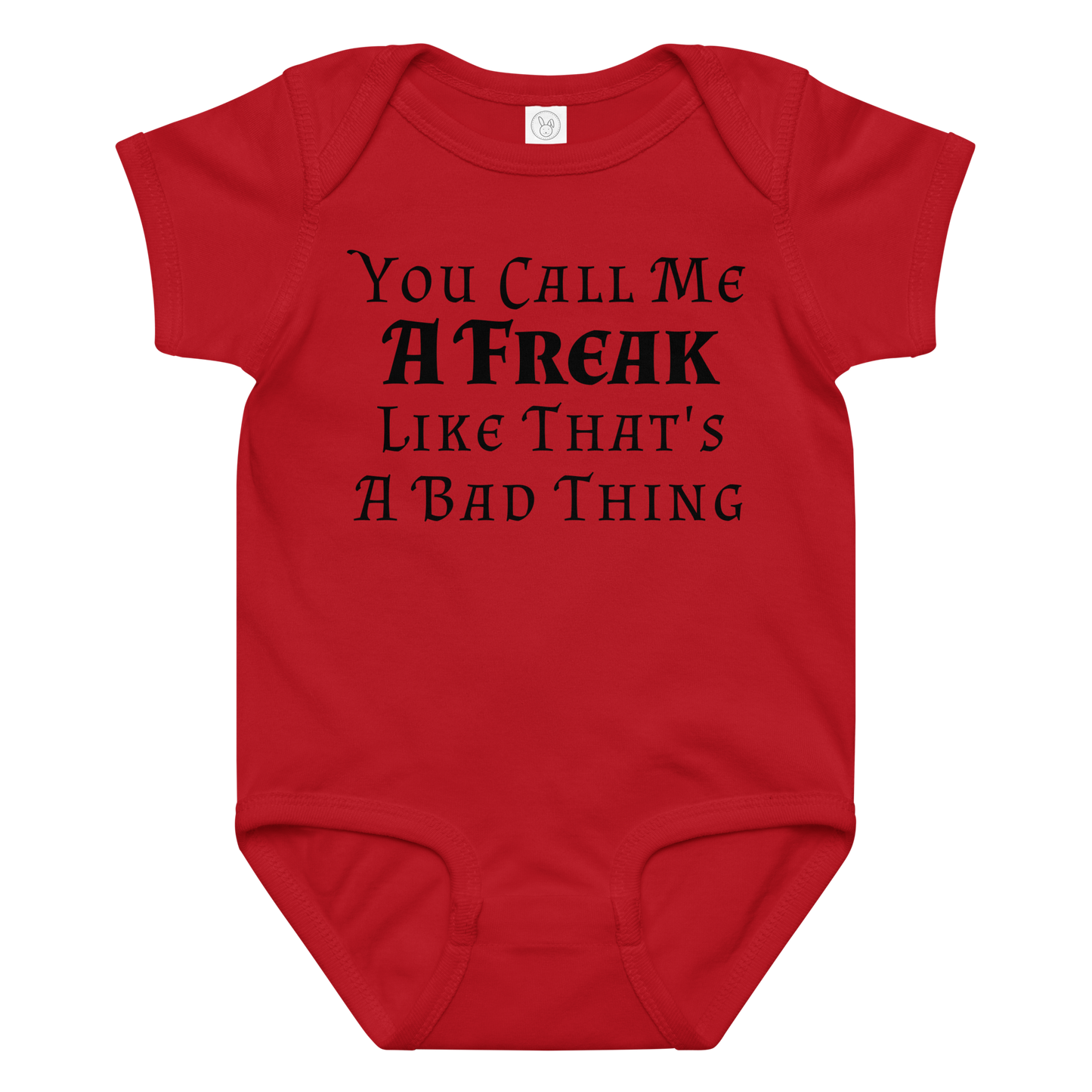 "You Call Me A Freak Like That's A Bad Thing" printed on a red baby jersey bodysuit laying on a flat surface amongst other clothes